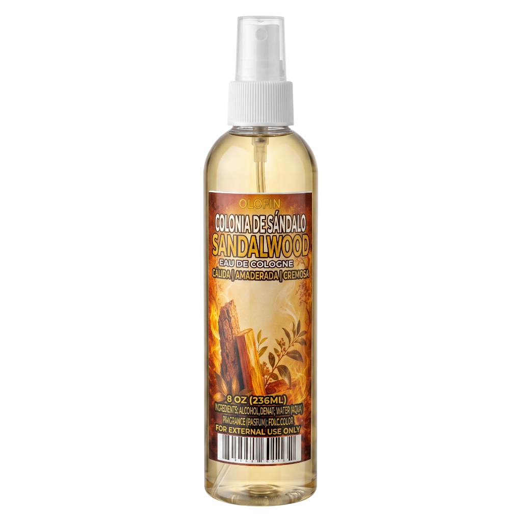 A 8 oz spray bottle of Colon Desandalo Sandalwood Natural Pajamero and Cleanser, featuring a white spray nozzle and a label with warm orange, brown, and yellow sandalwood wood grain illustrations.