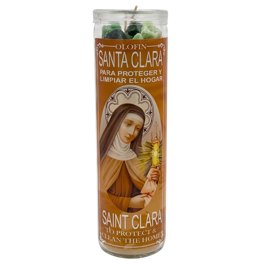 A tall glass jar candle with a brown label featuring Saint Clara, shown on a plain white background. The candle contains green and white wax at the top, and the label includes Spanish and English text for 'Santa Clara' and 'Saint Clara'.