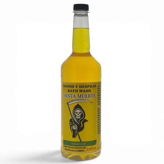 A bottle of Santa Muerte Bath Wash with a black cap, filled with yellow liquid, featuring a label with a grim reaper illustration on a white background.