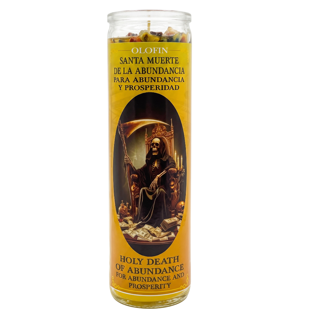 A tall glass jar candle with a yellow label featuring an illustration of Santa Muerte seated on a throne. The label reads 'OLORIN SANTA MUERTE DE LA ABUNDANCIA PARA ABUNDANCIA Y PROSPERIDAD' and 'HOLY DEATH OF ABUNDANCE FOR ABUNDANCE AND PROSPERITY'.