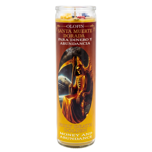 A tall glass prayer candle with a gold and brown label featuring an illustration of a grim reaper holding a scythe. The label has Spanish text reading 'Olofin Santa Muerte Dorada Para Dinero Y Abundancia' and 'Holy Death Golds Money and Abundance,' with multicolored wax visible at the top.