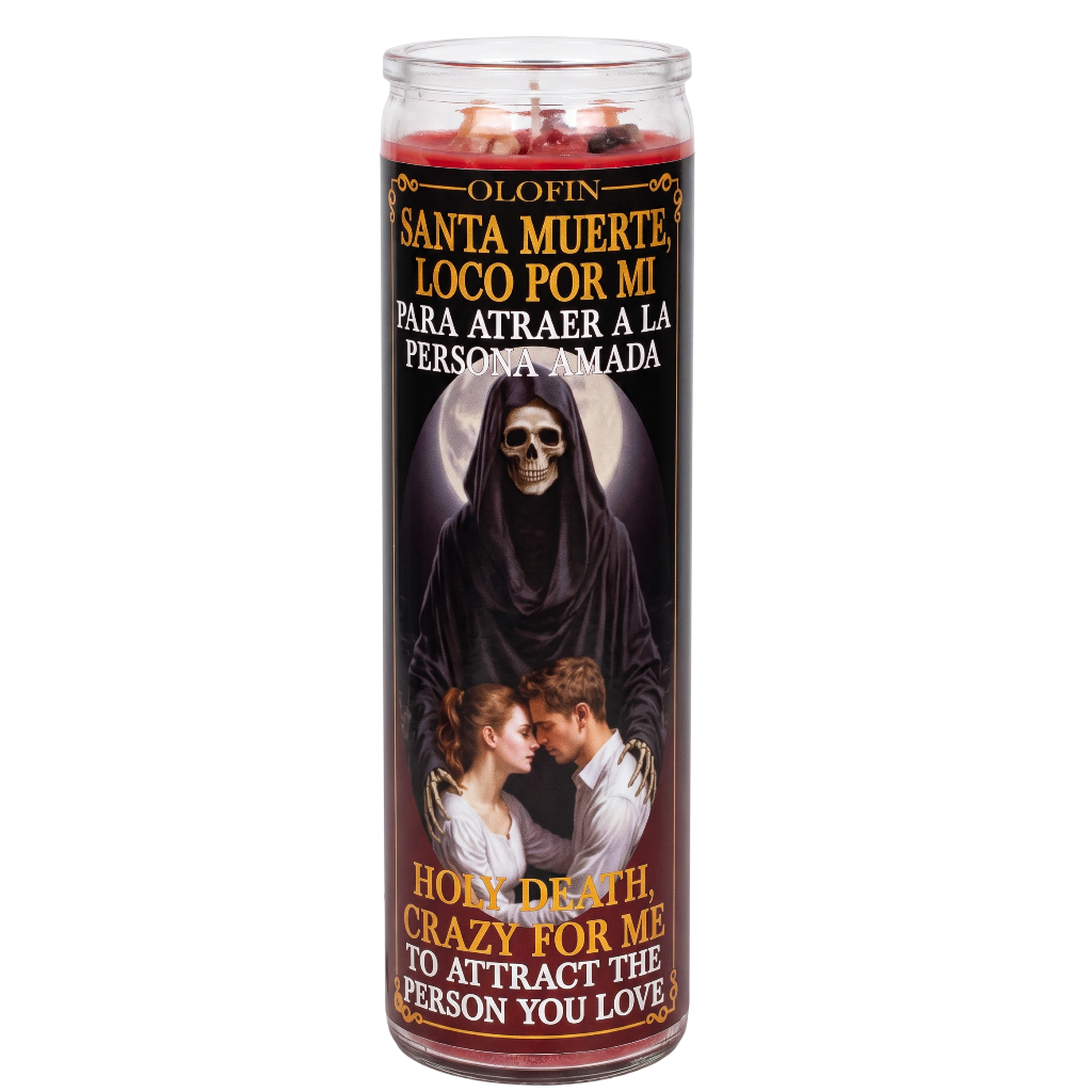 A tall glass jar candle with a printed Santa Muerte label, shown on a plain white background. The label features a dark hooded skeleton, a couple embracing, and Spanish and English text reading 'Olofin Santa Muerte Loco Por Mi Para Atrair A La Persona Amada' and 'Holy Death, Crazy For Me, To Attract The Person You Love.