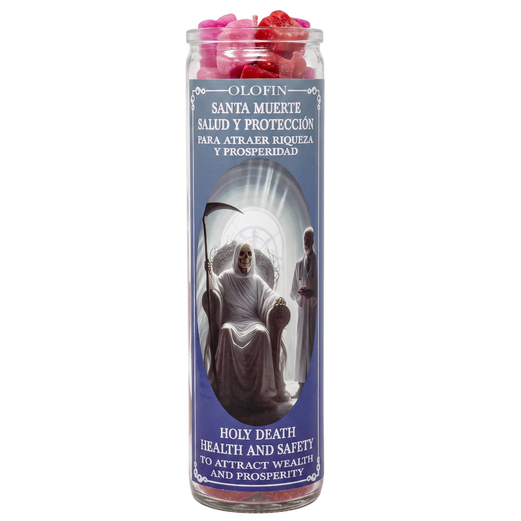 A tall glass jar candle with a blue label featuring Santa Muerte artwork and Spanish and English text. The candle is filled with pink and red wax pieces visible at the top, set against a plain white background.
