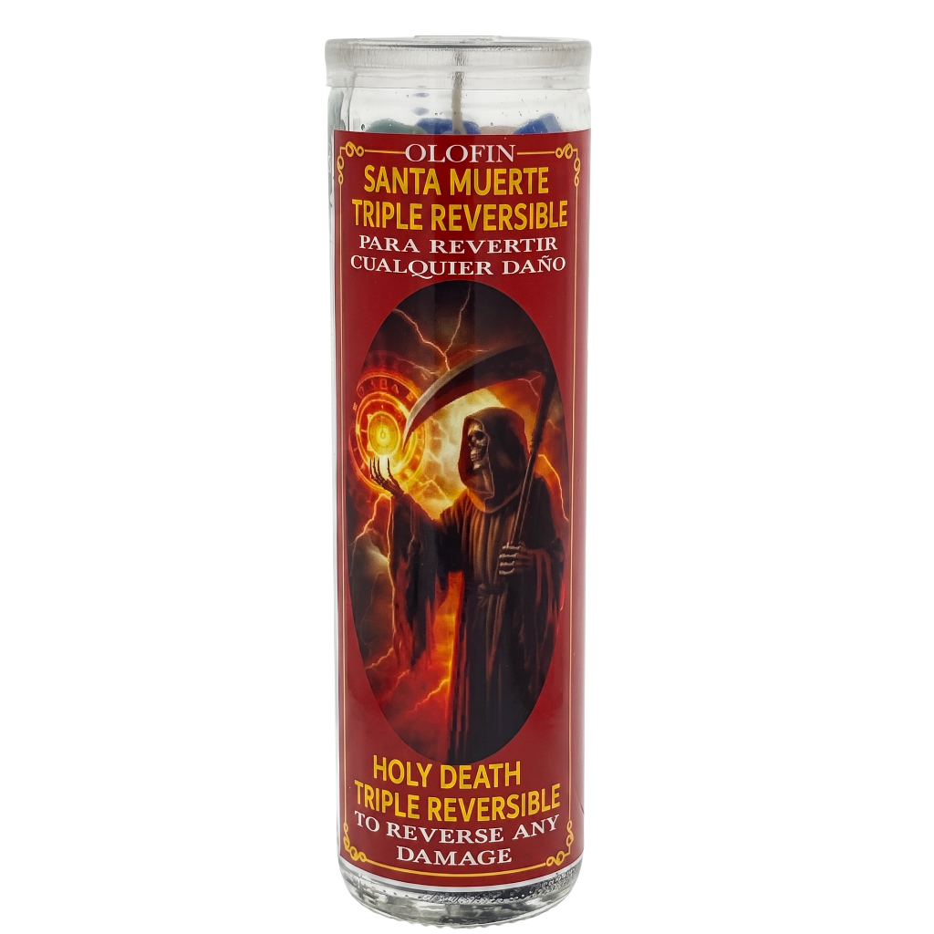 A tall glass prayer candle with a red label featuring Santa Muerte artwork and text reading 'Holy Death Triple Reversible' on a plain white background.