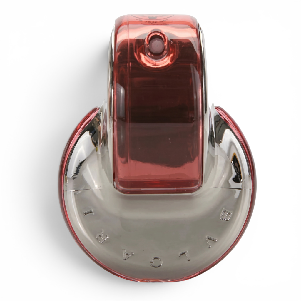 Red and silver perfume bottle with brand name on a white background