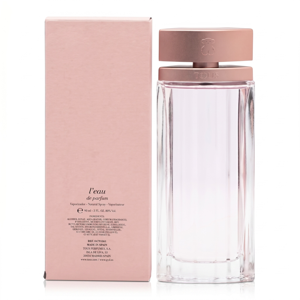 Perfume bottle with rose gold cap and packaging on a white background
