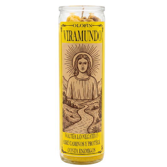A tall glass jar candle with a yellow label featuring an illustration of the Virgin Mary and Spanish text, including 'OLFIN VIRAMUNDO'.