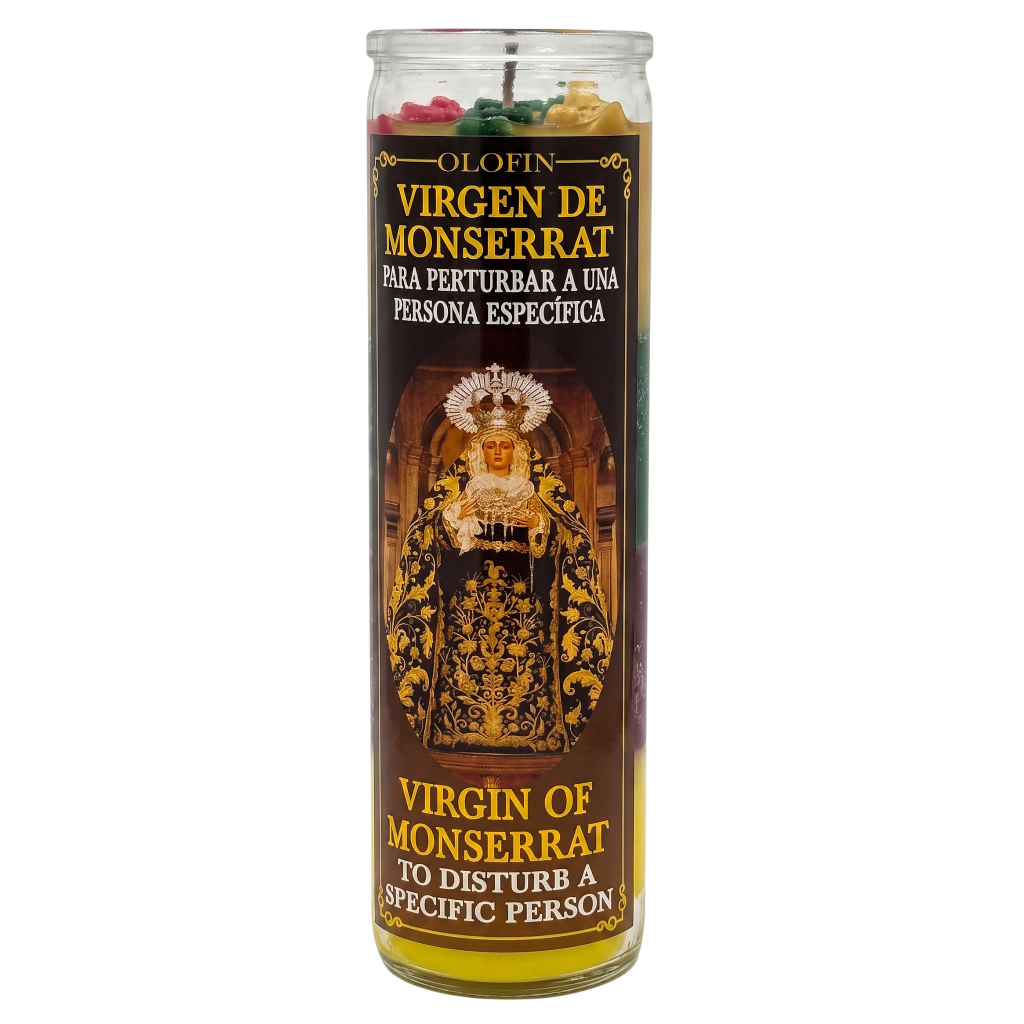A tall glass jar candle labeled 'Olofin Virgen de Monserrat' with Spanish and English text, featuring a dark brown label with gold and white lettering and an illustration of the Virgin of Monserrat. The candle contains multicolored wax pieces visible at the top.